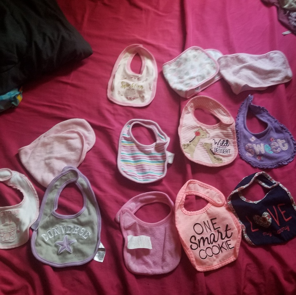 9 baby bibs and 3 burp cloths